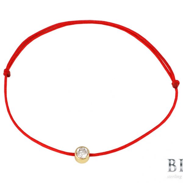 Златна гривна „PURE” с червен цвят на конеца с камън циркон на бижутерия Blessa цена 55.00лв